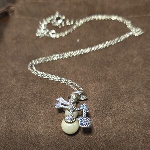 Elegant Silver Necklace with Cream and Silver Charms